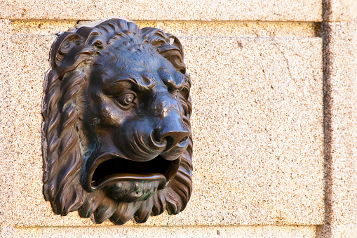 Post Office  bronze mailbox,  in the shape of the head of a lion. Seen in the street in Padrón town, A Coruña province, Galicia, Spain