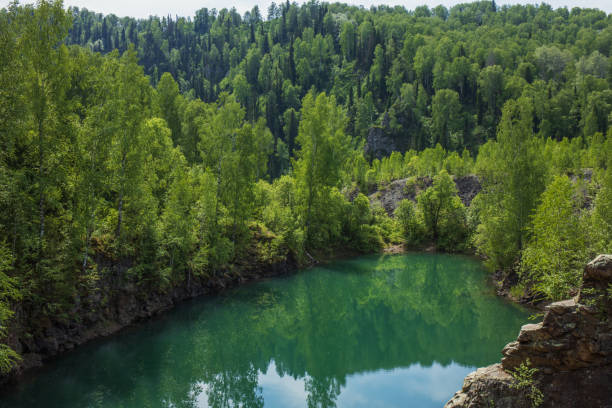 istock A beautiful mountain lake in a green coniferous forest. 1435761608