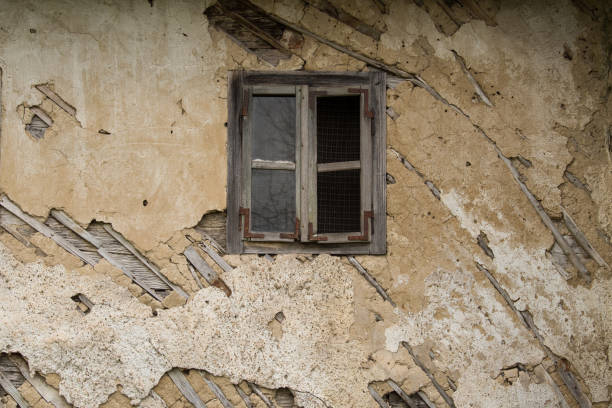 Croatia, October 20,2022 : Facade of mud and straw on old wooden house.