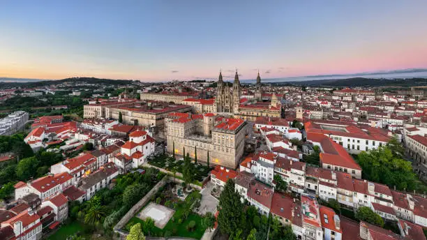 Santiago de Compostela with the famous Santiago de Compostela Cathedral at Twilight before Sunset. Drone View Panorama overlooking the Urban Cityscape. Santiago de Compostela, A Coruña Province, Galicia, Spain, Europe