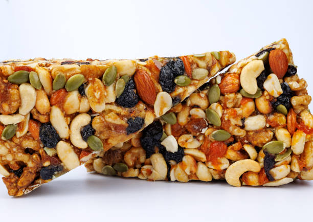 istock Kozinak from various nuts with dried fruits on white background. 1435774452