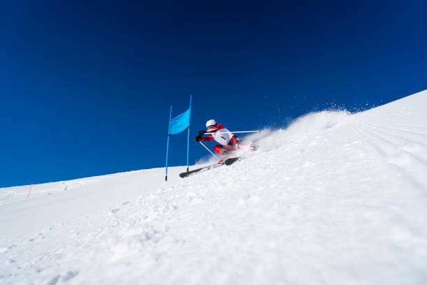 istock Alpine ski racer skiing close to giant slalom gate 1435774853