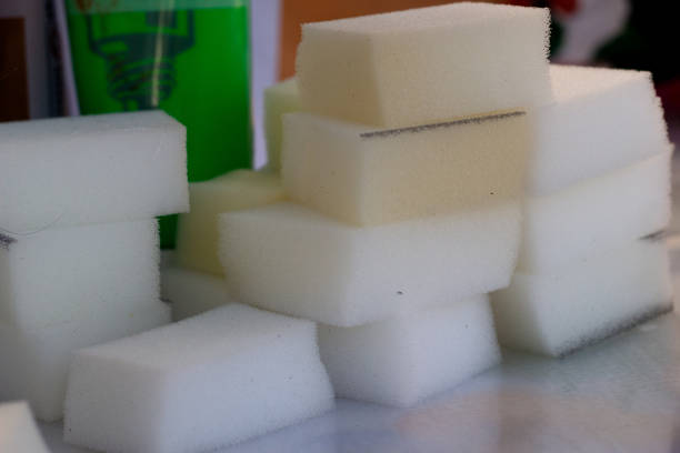 Sliced pieces of white foam insulation on the table. Stacked on top of each other. A device for drawing. applying paint.