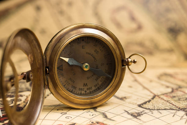 istock Vintage compass with sundial on old map. Adventure retro style. 1435776660