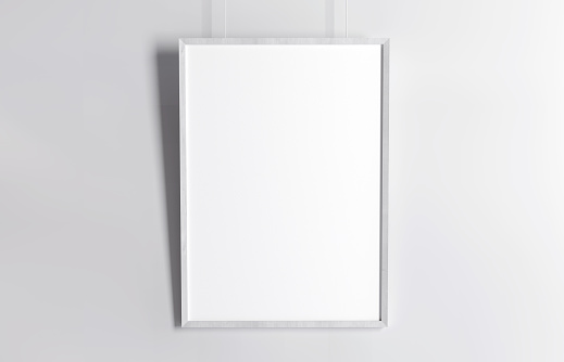 White vertical poster mockup with soft shadow, hanging on white wall