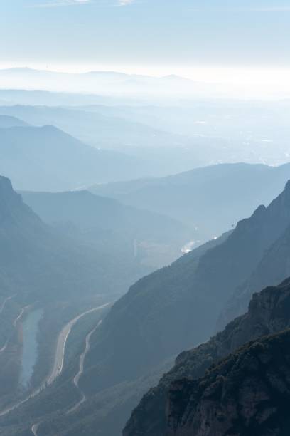 istock Mountain landscape with misty weather and blue sky 1435778925