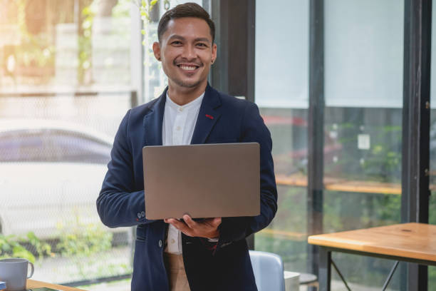 istock Team of business use calculators and graph analysis computer laptop tablets to plan marketing strategies and make profitable investments for the company. 1435779528