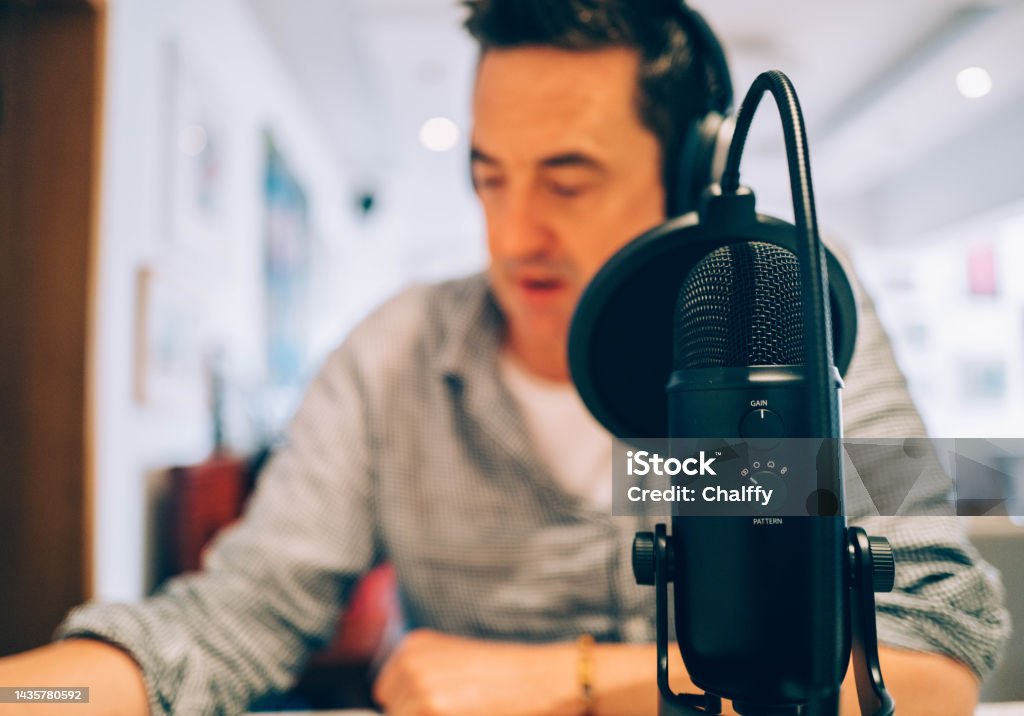 Making Podcast at Home Man Making Podcast at Home 45-49 Years Stock Photo