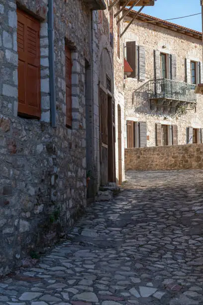 Photo of Dimitsana village traditional architecture and paved alleys in Arcadia, Greece