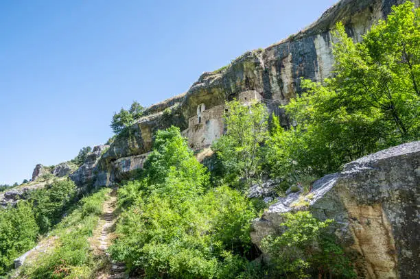 Photo of The panorama of the Hermitage of San Bartolomeo in Legio built with stones and carved into the rock