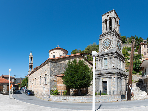 Church of Taxiarches (the greatest brigadiers) and bell clock tower in Lagadia village, Arcadia, Greece