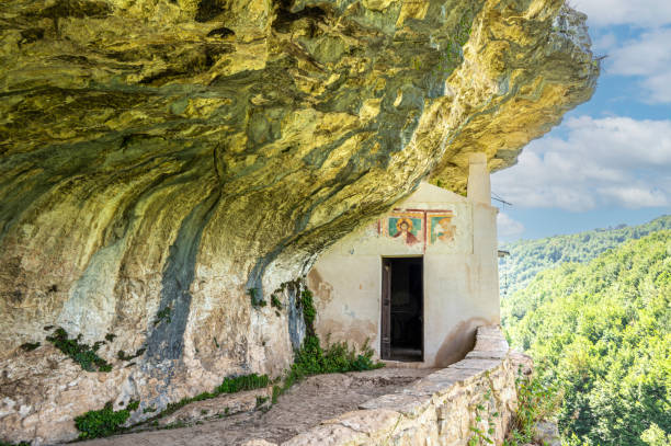 The façade carved into the rock of the Hermitage of San Bartolomeo in Legio stock photo