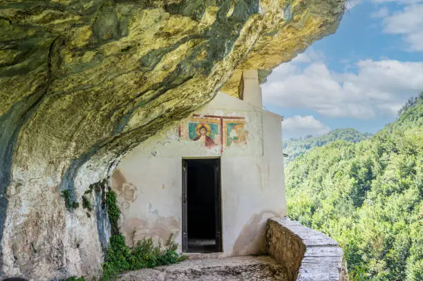 Photo of The façade carved into the rock of the Hermitage of San Bartolomeo in Legio