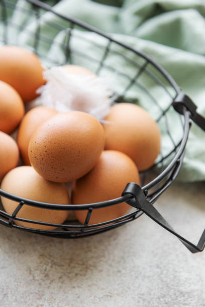 istock Basket of fresh brown eggs 1435783950