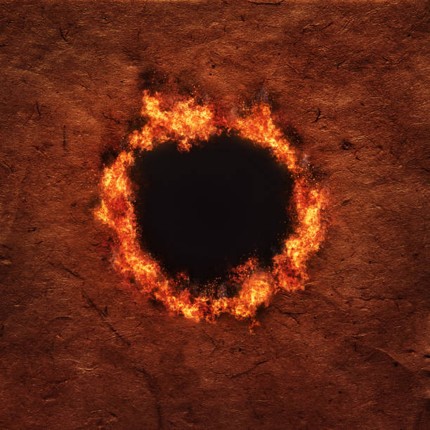 Fiery hole burns in fibrous antique art paper, with space for copy.