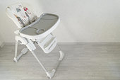 Baby high chair. Special children's furniture for feeding babies. Selective focus