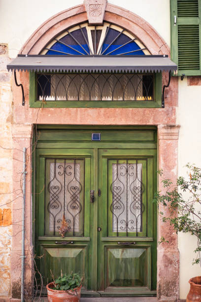 istock Classic facade with green vintage door 1435790357