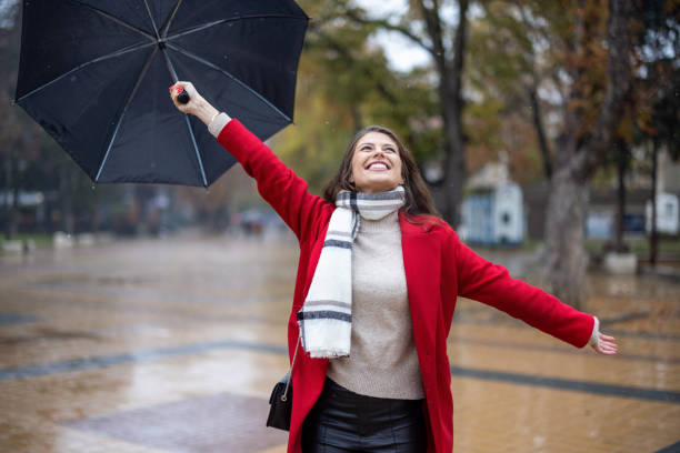 istock Elegant lady enjoying rainy weather 1435790616