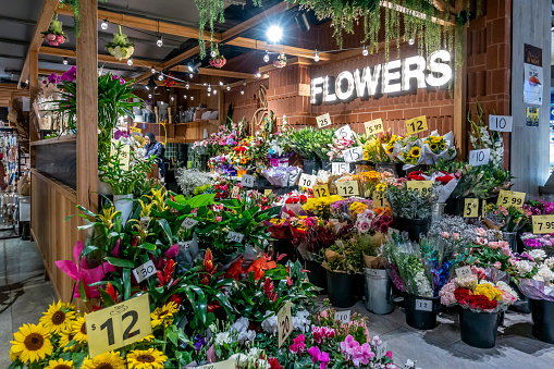 Sydney, Australia - Mar 10, 2021: Florist's assorted flower display at front of the store in Roselands Shopping Centre. A representation of an Australian small business.