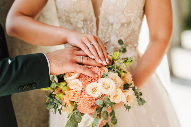 bride and groom's hands - wedding behavior horizontal men imagens e fotografias de stock