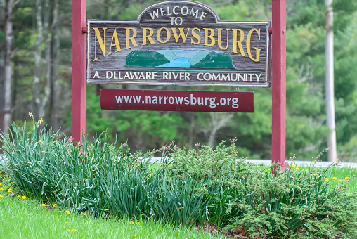 Narrowsburg, New York, United States of America - April 29, 2017. Welcome to Narrowsburg sign at the entrance to Narrowsburg, NY.