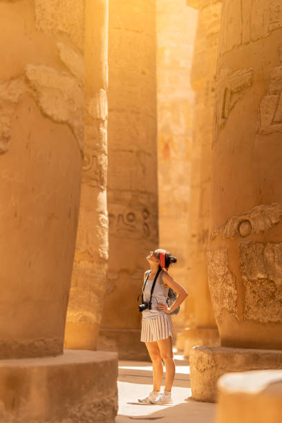 istock Tourist with camera in ancient Egyptian temples 1435803552
