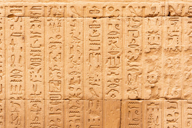 istock Hieroglyphs engraved in relief on an ancient Egyptian temple wall 1435803561