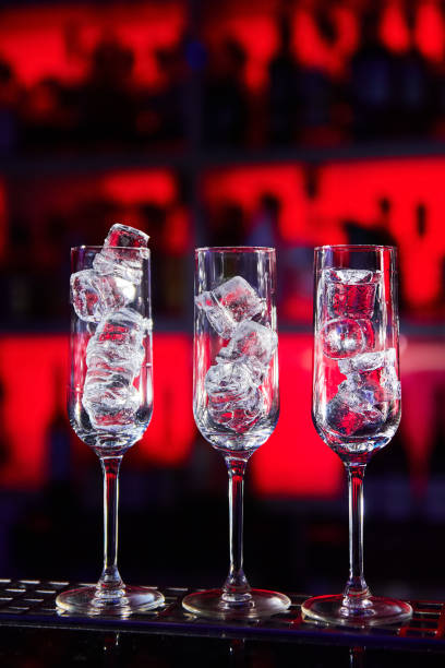 istock Empty glasses with ice cubes on the bar 1435806459