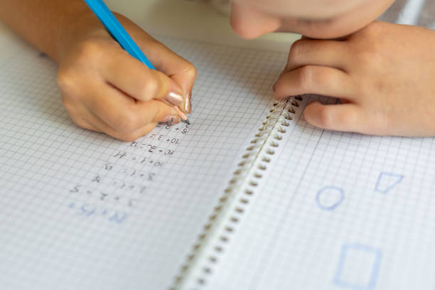 istock Young girl writing 1435810912