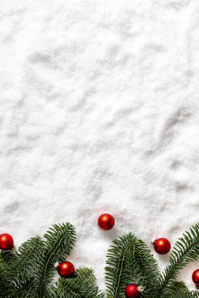 White Snow texture with Christmas decorations and fir tree branches for festive season backgrounds stock photo