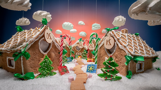 Gorgeous and handmade Christmas gingerbread village with candies and cookies. Gingerbread village for Christmas.