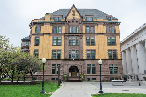 Boston, Massachusetts, USA - May 13, 2021: Baker Library on the Harvard Business School (HBS) campus. Dedicated in 1927 and named for George F. Baker, the benefactor who funded HBS's original campus. It is the largest business library in the world.