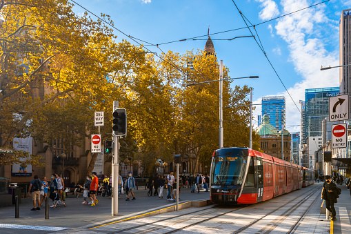 Sydney, NSW, Australia - April 16, 2022: Sydney city light rail tram stopped at Town Hall while viewed along George street on a day