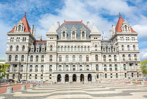 Albany, New York, United States of America - April 26, 2017. New York State Capitol building in Albany, NY. The seat of the New York State government, the capitol building is part of the Empire State Plaza complex on State Street in Capitol Park. Housing the New York State Legislature, the building was completed in 1899. The building is a combination of Romanesque Revival and Neo-Renaissance architectural styles.