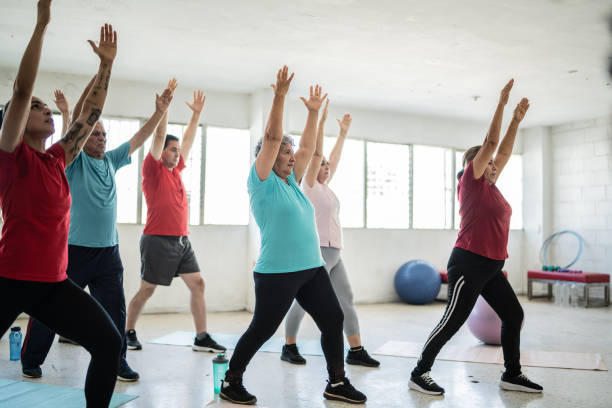 istock Group of seniors stretching in a yoga class at the studio 1435829981