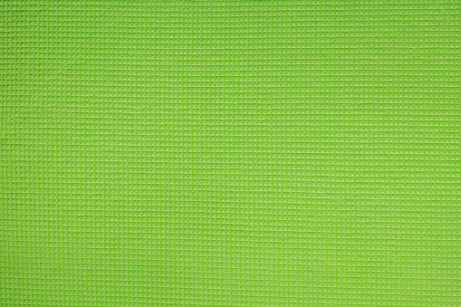 Bright green embossed background with waffle texture.