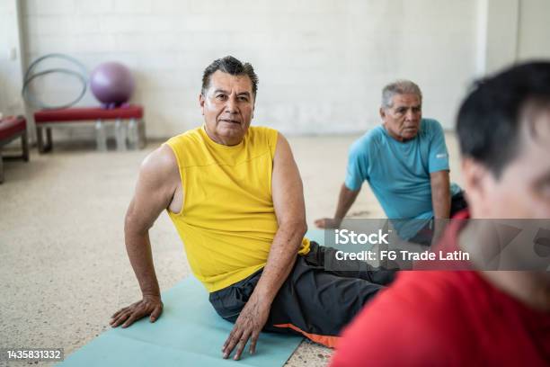 Portrait Of Senior Man In A Yoga Class At The Yoga Studio Stock Photo - Download Image Now