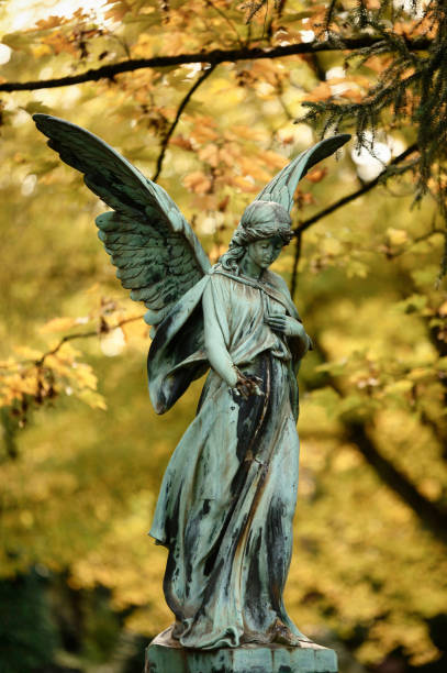 istock angel with wings in a cemetery 1435834248