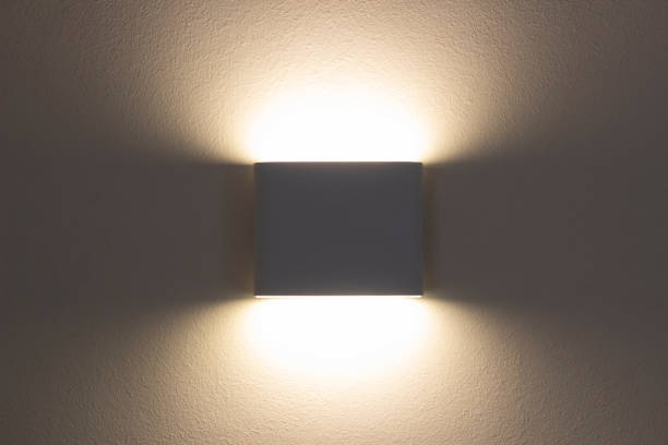 istock LED wall lamp close-up. Modern minimalistic bedside lamp for the bedroom 1435837795
