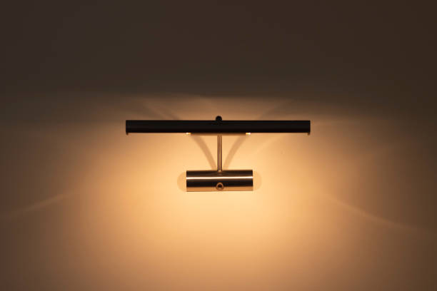 LED wall lamp close-up. Modern minimalistic bedside lamp for the bedroom