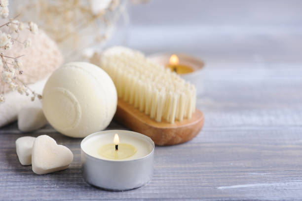 istock Bath bombs with dry flowers and lit candles 1435839242