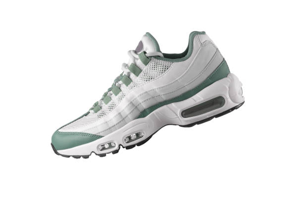 istock White sneaker with light green accents on a white isolated background 1435842592