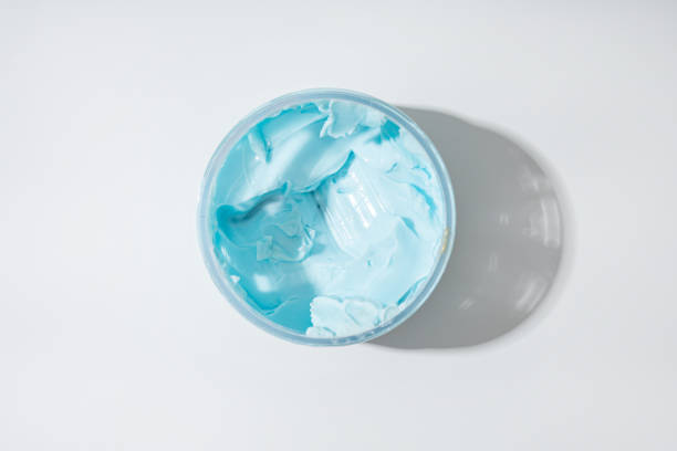 Top view of blue cream boby sutter in jar cometic products stock photo