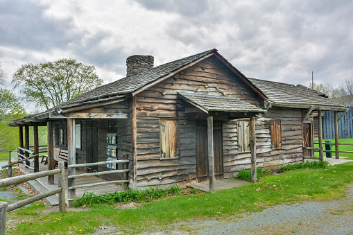 Narrowsburg, New York, United States of America - April 29, 2017. Replica of a wooden building of Fort Delaware in Narrowsburg, NY. Fort Delaware is a reconstructed log fort from the 1750s. The present day Fort, a replica of the frontier lower fort of the Cushetunk settlement of 1755-1785, was originally located 6 miles up river near Milanville, PA.