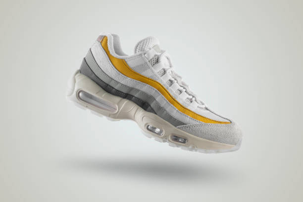 istock Light gray sneaker with yellow accents on a white isolated background 1435843333