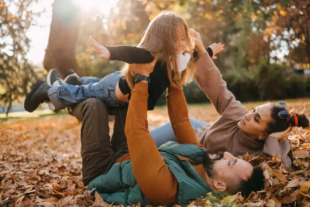 Photo of Family playing in the park