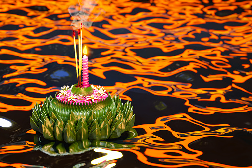 Beautiful Krathong Baitong from Thailand's Loy Krathong Festival, rendered in 3D as it floats down a river.