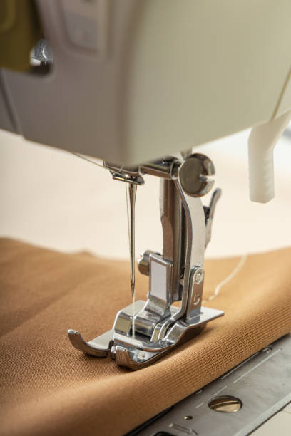 istock Sewing machine sewing a piece of fabric. Close-up 1435859837