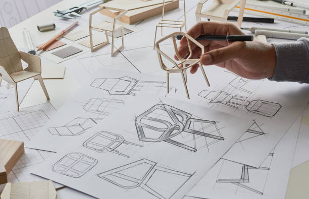 istock Designer sketching drawing design development product plan draft chair armchair Wingback Interior furniture prototype manufacturing production. designer studio concept . 1435860156