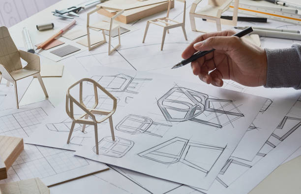 istock Designer sketching drawing design development product plan draft chair armchair Wingback Interior furniture prototype manufacturing production. designer studio concept . 1435860166